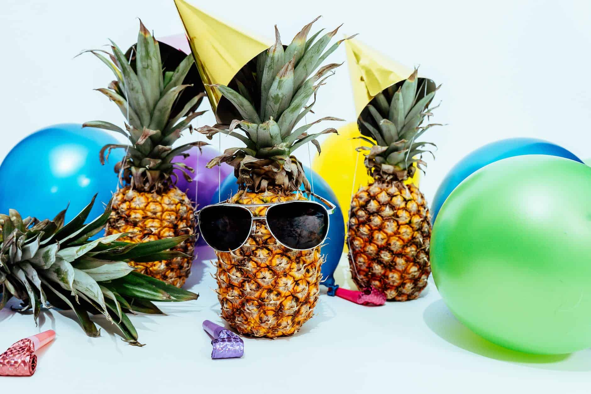 photo of three pineapples surrounded by balloons - birthday freebies