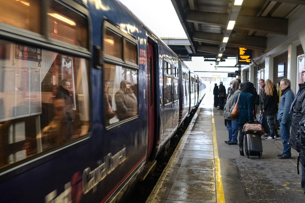 People waiting to board a train