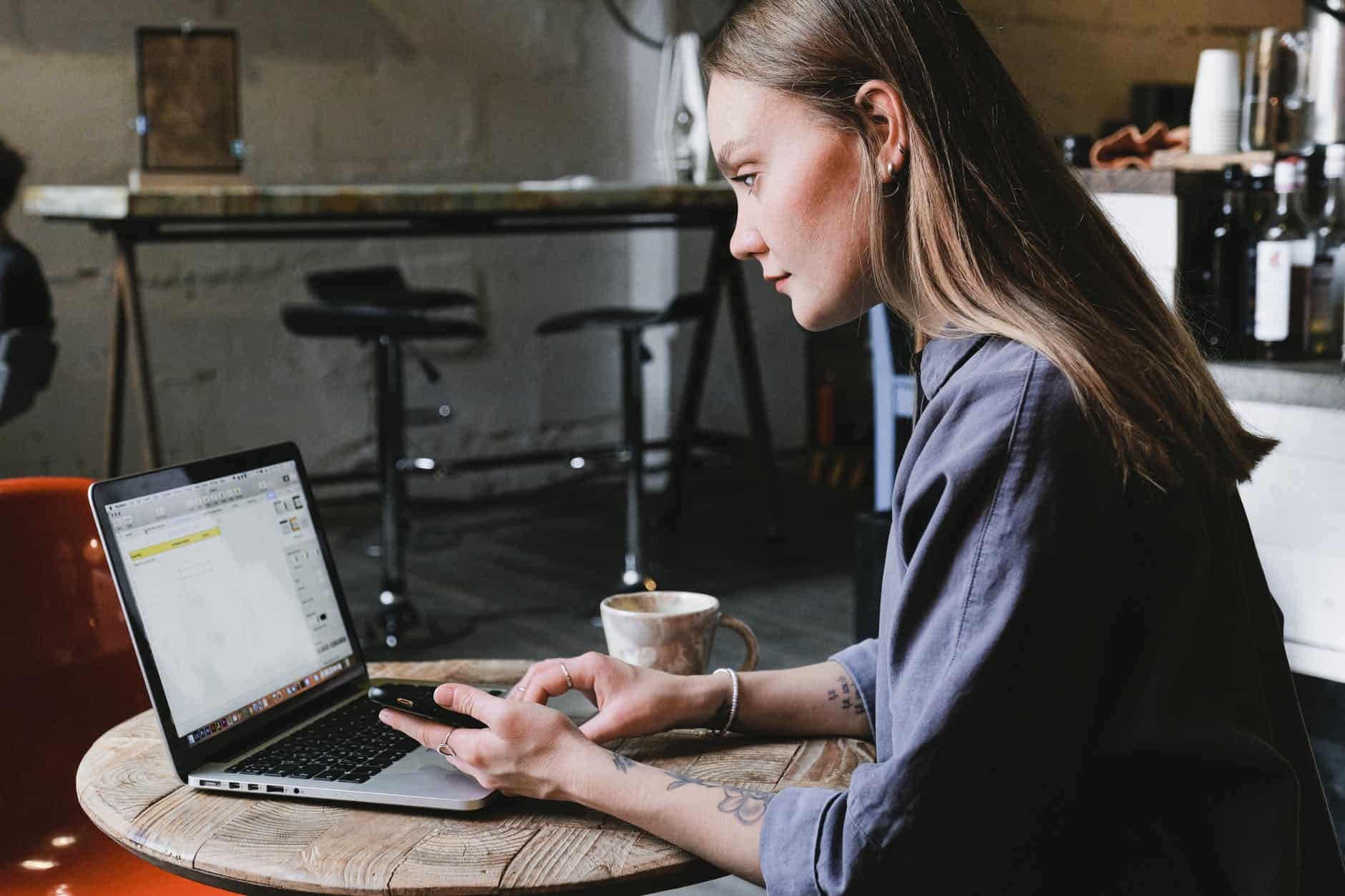 young woman surfing internet YunoJuno - Cheap Professional Indemnity Insurance