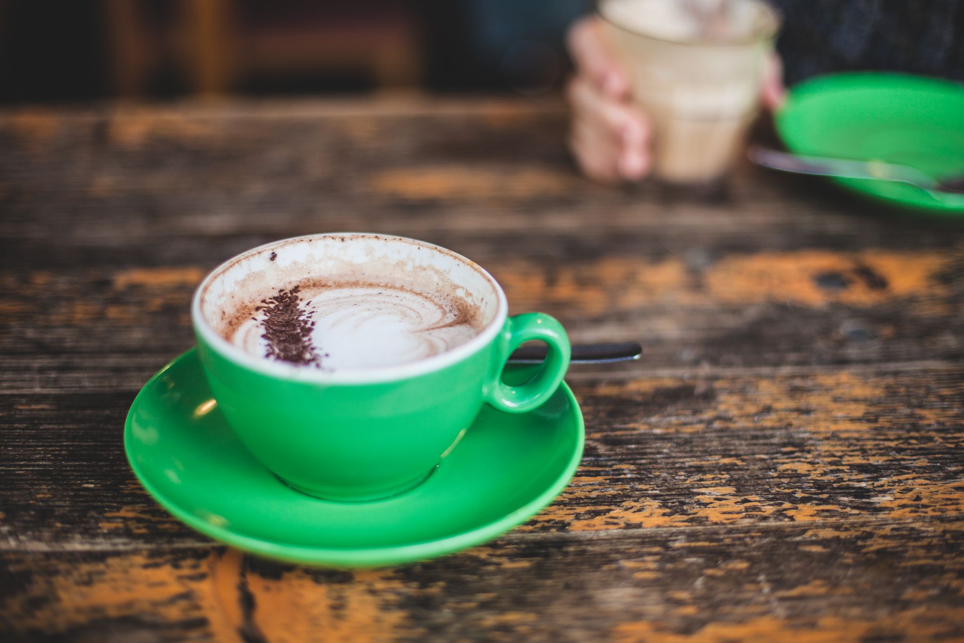 white ceramic mug with cappuccino